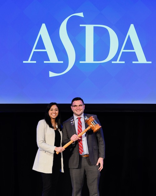 ASDA 2020-21 Speaker of the House of Delegates Joseph Manzella, Stony Brook University School of Dental Medicine ’21 (R) accepting the gavel from his predecessor, Anisha Pandaya, Boston University Henry M. Goldman School of Dental Medicine ’21.