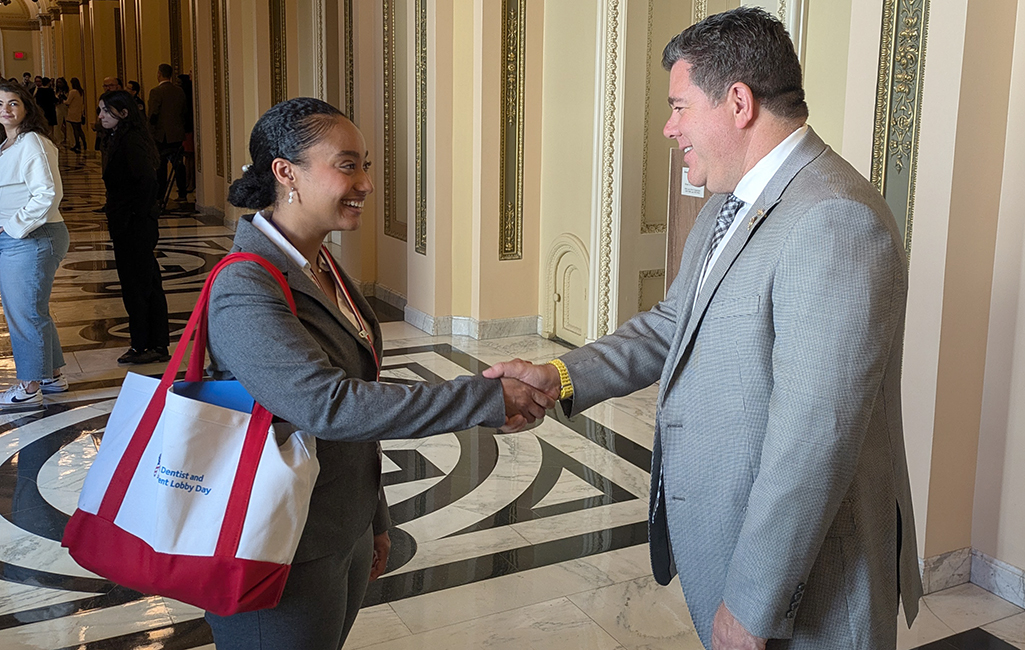 SDM student meets Congressman Nick LaLota inside the US Capitol.