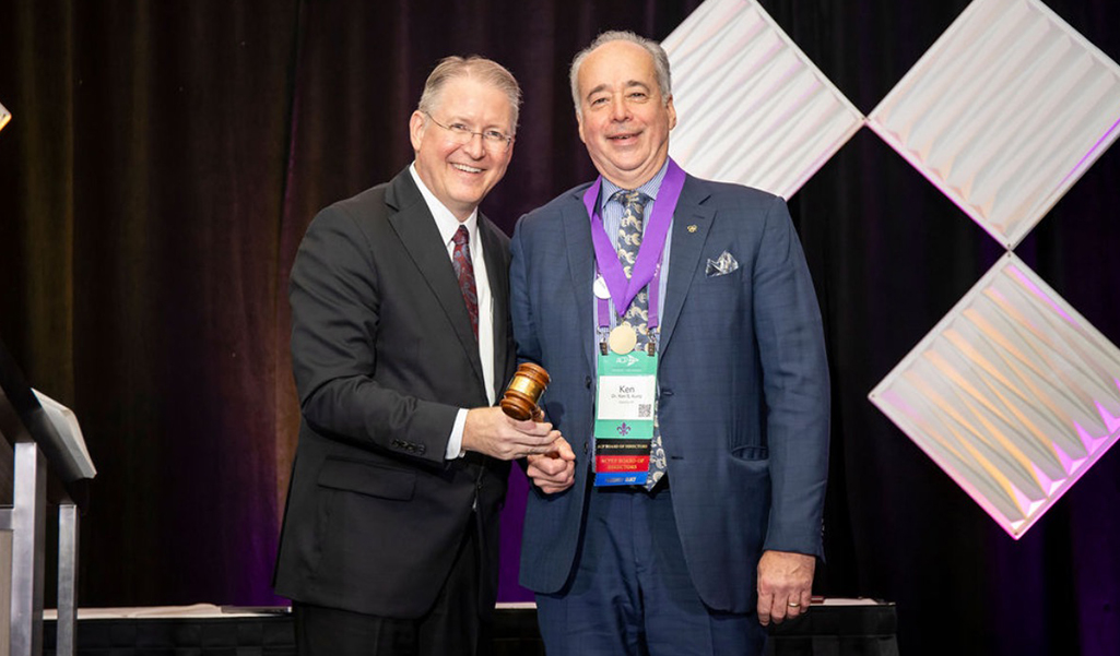 Kenneth Kurtz (right) shaking hands with another individual