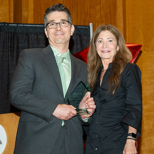Award recipient Greg Maddalena (left) with alumni chapter president Stacy Reisfeld
