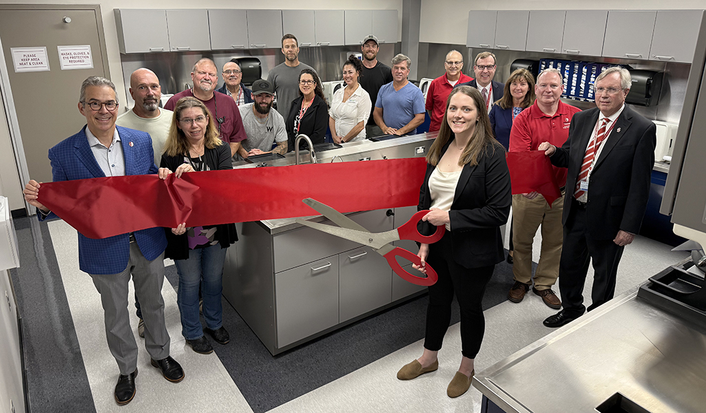 Ribbon cutting ceremony for student wet lab with school faculty and university administration and staff