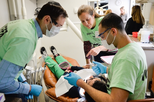 Faculty and Students Provide Dental Care to Children at Give Kids a Smile Event