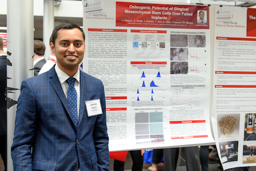 Junaid Rajani presents his research poster, "Osteogenic Potential of Gingival Mesenchymal Stem Cells Over Failed Implants."