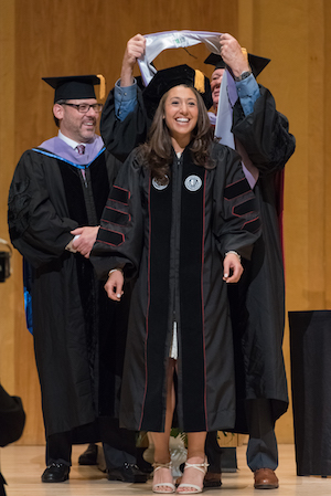 Alexis Gertler, DDS, is hooded, signifying her academic achievement and doctoral degree at Stony Brook School of Dental Medicine's 2018 Convocation.