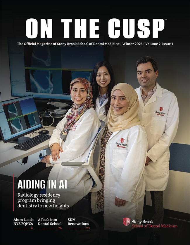 On the Cusp magazine front cover - three residents and mentor standing in digital lab