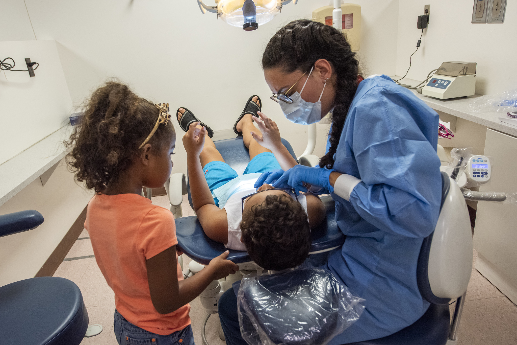 Stony Brook School of Dental Medicine student provides oral healthcare services to a child during the annual Give Kids A Smile Day event.