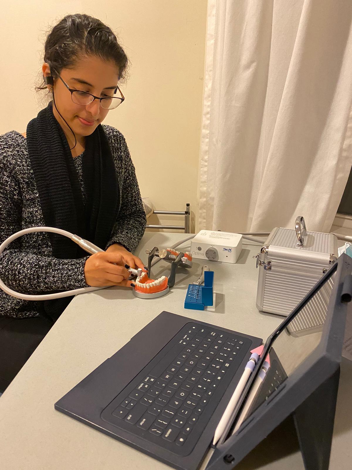 Viviana Torres Rizo practices hands-on dentistry techniques through a digital dentistry club meeting held virtually.