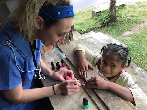 Stony Brook School of Dental Medicine Student Ilana Dashut Paints Young Girl's Nails in Madagascar