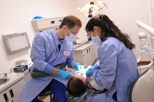 Students preforming dental work