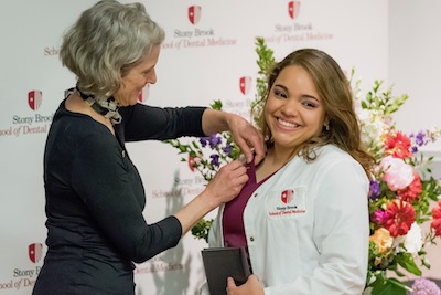 Lisbeth Hernandez Receives Dental Assistant Pin at Stony Brook School of Dental Medicine's Graduation Ceremony