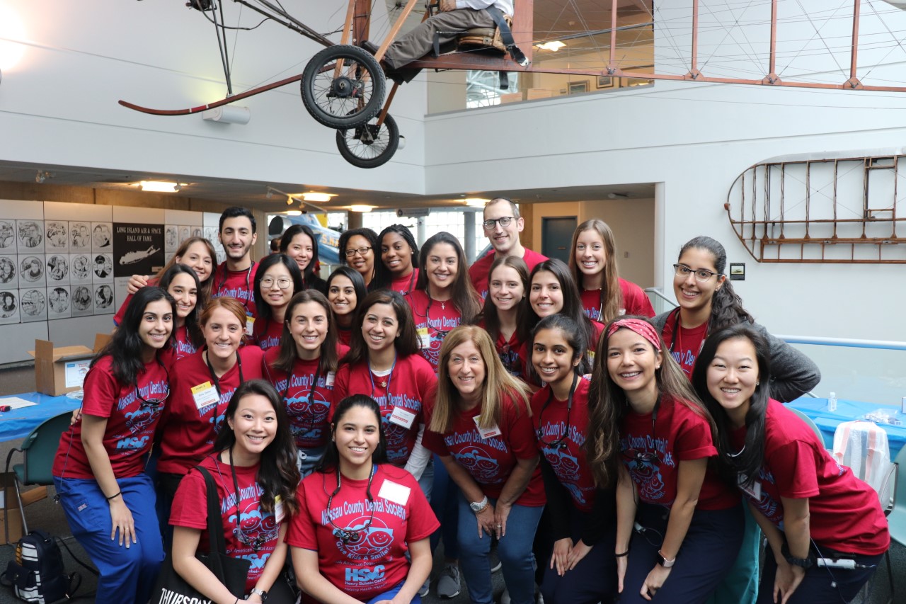 Stony Brook School of Dental Medicine students and faculty at Nassau County Dental Society's Give Kids A Smile event at the Cradle of Aviation.