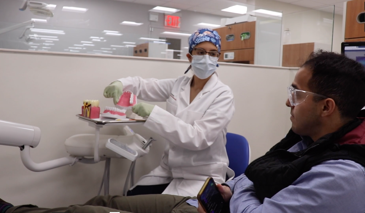 Viviana Torres Rizo provides oral health instruction to a patient.