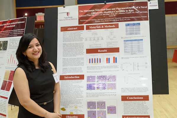 Dr. Heta Dinesh Bhatt with her research poster at Stony Brook University School of Dental Medicine's 2019 Leo and Mickey Sreebny Lectureship and School of Dental Medicine Research Symposium