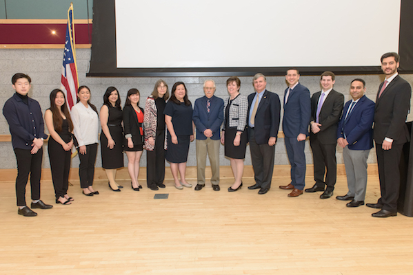 Winners of research awards stand for a group photo with faculty and leadership at the Stony Brook University School of Dental Medicine 2019 Leo and Mickey Sreebny Lectureship and School of Dental Medicine Research Symposium